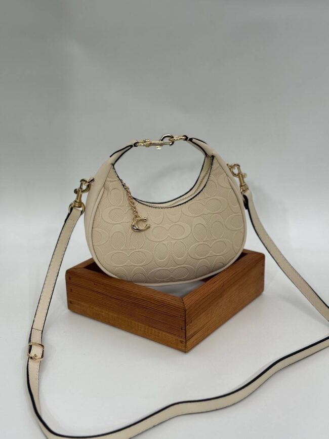 Coach Gofraj ay modeli orta boy bej çanta