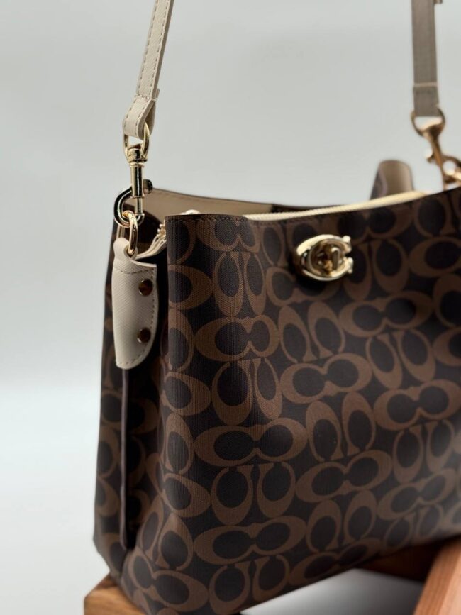 Coach Gofraj baskılı kilitli büzgülü kahve bej çanta