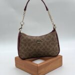 Coach Gofraj baget bordo kum çanta