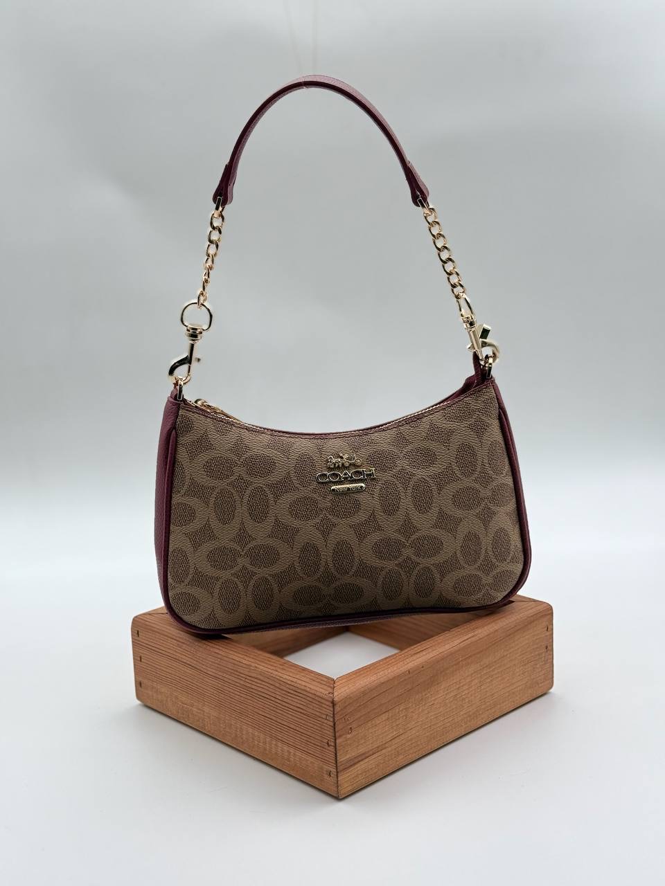 Coach Gofraj baget bordo kum çanta