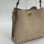 Coach Gofraj baskılı kilitli büzgülü vizon çanta