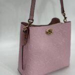 Coach Gofraj baskılı kilitli büzgülü pembe çanta