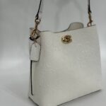 Coach Gofraj baskılı kilitli büzgülü beyaz çanta