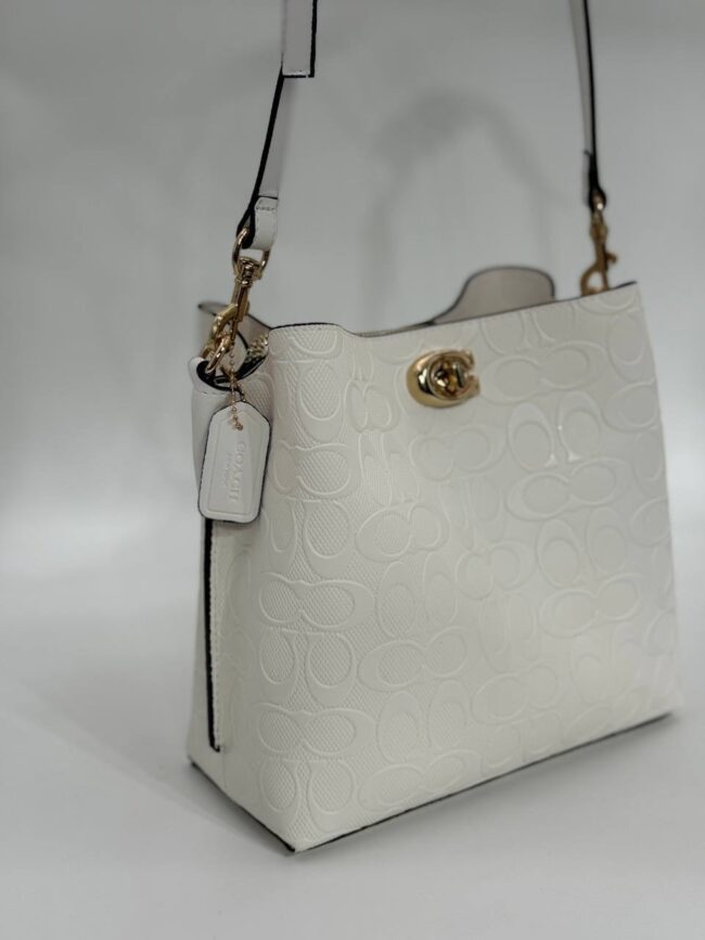 Coach Gofraj baskılı kilitli büzgülü beyaz çanta