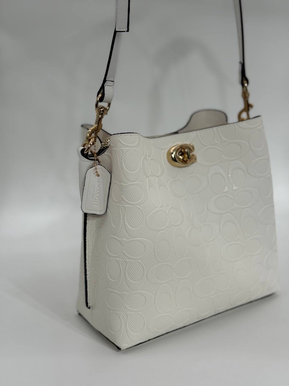 Coach Gofraj baskılı kilitli büzgülü beyaz çanta